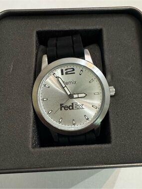 A Remix FedEx promotional analog quartz wrist watch.